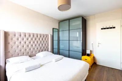 Un ou plusieurs lits dans un hébergement de l'établissement GuestReady - Cosy flat with a view of Montmartre