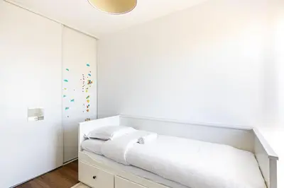 Un ou plusieurs lits dans un hébergement de l'établissement GuestReady - Cosy flat with a view of Montmartre