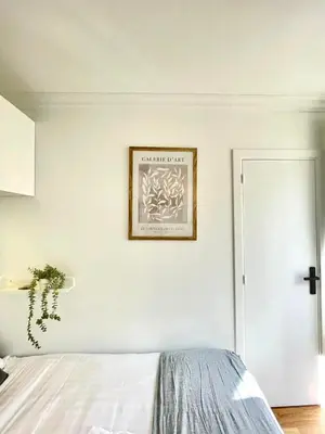 Un ou plusieurs lits dans un hébergement de l'établissement New 147 Suite Tonton - Cosy Apartment Paris Center