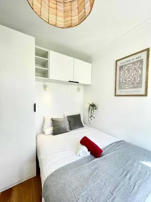 Un ou plusieurs lits dans un hébergement de l'établissement New 147 Suite Tonton - Cosy Apartment Paris Center