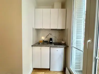 Cuisine ou kitchenette dans l'établissement New 413 Suite Henri - Cosy Apartment Paris Center