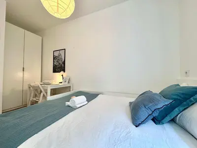 Un ou plusieurs lits dans un hébergement de l'établissement New 414 Suite Grant - Cosy Apartement Paris Center