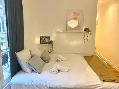 Un ou plusieurs lits dans un hébergement de l'établissement New 422 Suite Louis - Cosy Apartment Paris Center