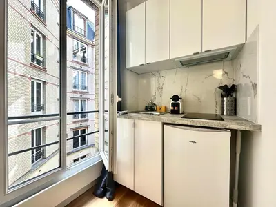 Cuisine ou kitchenette dans l'établissement New 438 Suite Jean - Cosy Apartment Paris Center