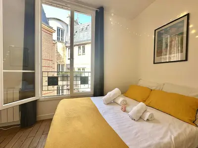 Un ou plusieurs lits dans un hébergement de l'établissement New 442 Suite Edith - Cosy Apartment Paris Center