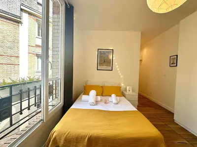 Un ou plusieurs lits dans un hébergement de l'établissement New 442 Suite Edith - Cosy Apartment Paris Center