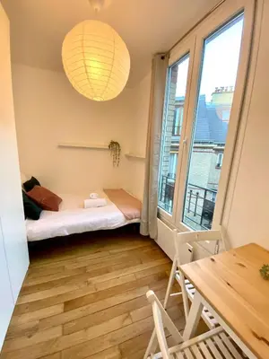 Un ou plusieurs lits dans un hébergement de l'établissement New 451 Suite Monroe - Cosy Apartment Paris Center