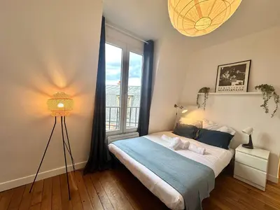 Un ou plusieurs lits dans un hébergement de l'établissement New 462 Suite Olivier- Cosy Apartment Paris Center