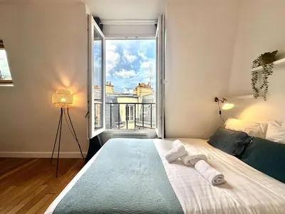 Un ou plusieurs lits dans un hébergement de l'établissement New 462 Suite Olivier- Cosy Apartment Paris Center