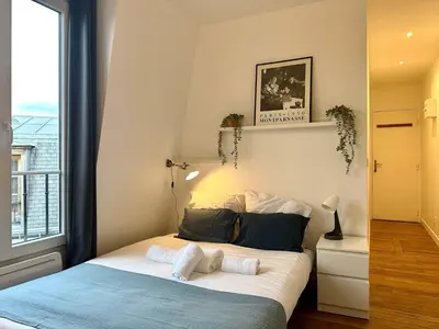 Un ou plusieurs lits dans un hébergement de l'établissement New 462 Suite Olivier- Cosy Apartment Paris Center