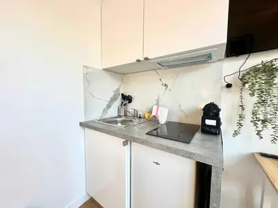 Cuisine ou kitchenette dans l'établissement New 463 Suite Macnee - Cosy Apartment Paris Center