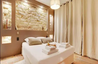 Un ou plusieurs lits dans un hébergement de l'établissement Amazing apartment center of Paris-Le marais