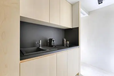 Cuisine ou kitchenette dans l'établissement Studio de Luxe Arc de Triomphe