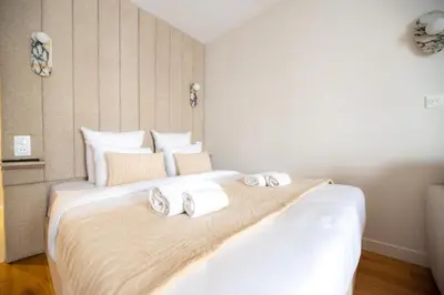 Un ou plusieurs lits dans un hébergement de l'établissement Charming Parisian Flat by Champs Elysées