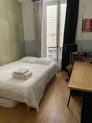 Un ou plusieurs lits dans un hébergement de l'établissement Family apartment near Marais in Oberkampf