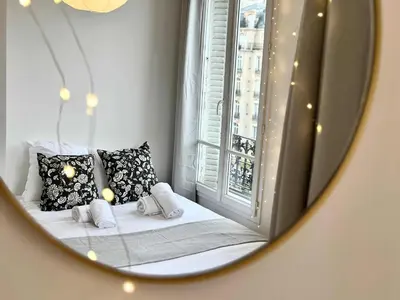 Un ou plusieurs lits dans un hébergement de l'établissement New 353 Suite Pierre - Cosy Apartment Paris Center