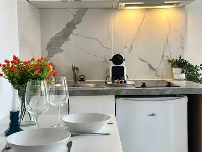 Cuisine ou kitchenette dans l'établissement New 353 Suite Pierre - Cosy Apartment Paris Center