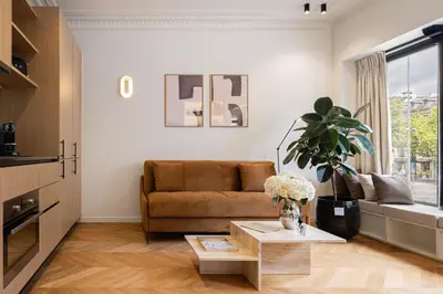 Coin salon dans l'établissement La Suite - Voltaire I - 1 bedroom with AC