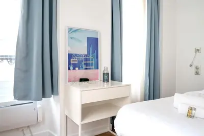 Un ou plusieurs lits dans un hébergement de l'établissement Appartement Rambuteau - Welkeys