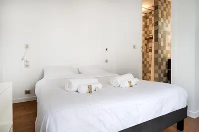 Un ou plusieurs lits dans un hébergement de l'établissement Appartement Rambuteau - Welkeys