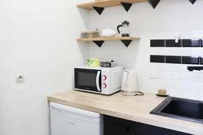 Cuisine ou kitchenette dans l'établissement Bright stay in the heart of Paris for 4 people