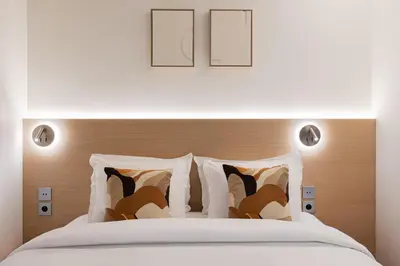 Un ou plusieurs lits dans un hébergement de l'établissement La Suite - Voltaire II - 2 bedrooms with AC