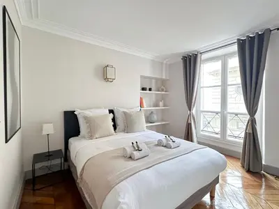 Un ou plusieurs lits dans un hébergement de l'établissement Luxembourg Gardens - Prestige family apartment for 8 with lift - 4 BR