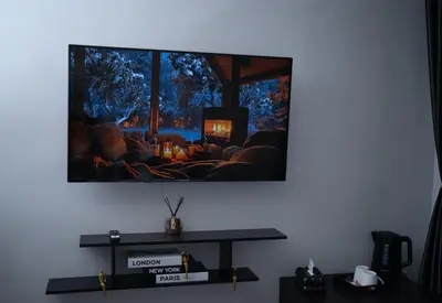 Télévision ou salle de divertissement dans l'établissement Hôtel Sofiane