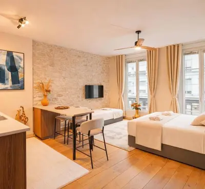 Un ou plusieurs lits dans un hébergement de l'établissement Le Marais - Premium studio for 3