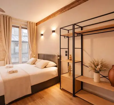 Un ou plusieurs lits dans un hébergement de l'établissement Le Marais - Premium studio for 3