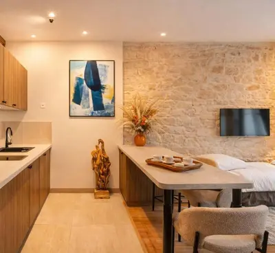 Cuisine ou kitchenette dans l'établissement Le Marais - Premium studio for 3