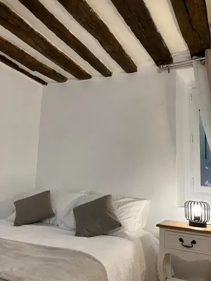 Un ou plusieurs lits dans un hébergement de l'établissement Cosy Flat Near Le Marais