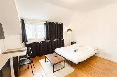 Un ou plusieurs lits dans un hébergement de l'établissement Studio Cosy avec Ascenseur Paris 16 - 2 personnes