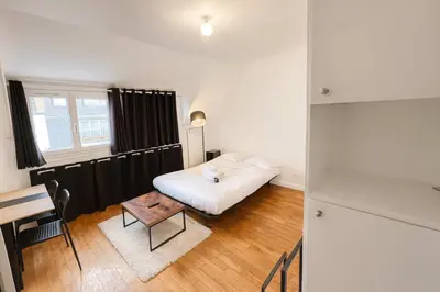 Un ou plusieurs lits dans un hébergement de l'établissement Studio Cosy avec Ascenseur Paris 16 - 2 personnes