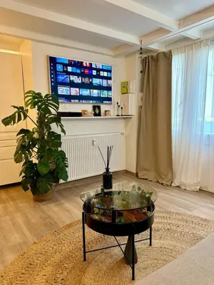 Télévision ou salle de divertissement dans l'établissement Duplex in Heart of Paris