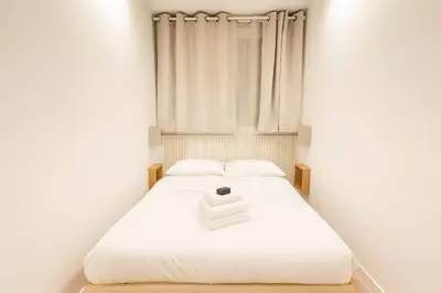 Un ou plusieurs lits dans un hébergement de l'établissement Appartement familiale parfait pour 4p - paris 13