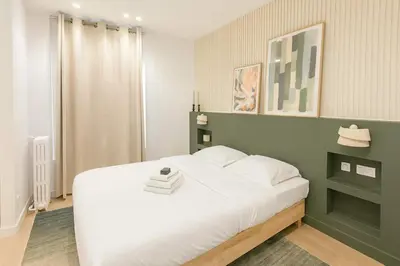 Un ou plusieurs lits dans un hébergement de l'établissement Appartement duplex familiale 2 chambres Paris 13