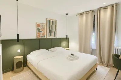 Un ou plusieurs lits dans un hébergement de l'établissement Appartement duplex familiale 2 chambres Paris 13