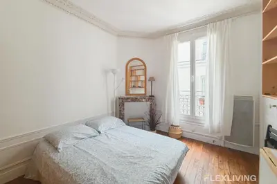 Un ou plusieurs lits dans un hébergement de l'établissement Lovely Studio in Paris 13
