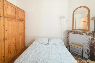 Un ou plusieurs lits dans un hébergement de l'établissement Lovely Studio in Paris 13