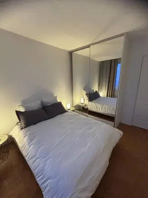 Un ou plusieurs lits dans un hébergement de l'établissement Luxe 2 bedrooms Paris 14th & Montrouge