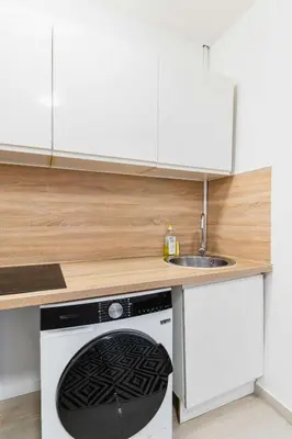 Cuisine ou kitchenette dans l'établissement Appartement cosy hopital bichat - paris 18 - 4P