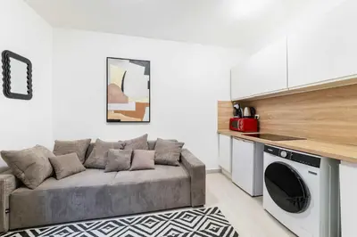 Cuisine ou kitchenette dans l'établissement Appartement cosy hopital bichat - paris 18 - 4P