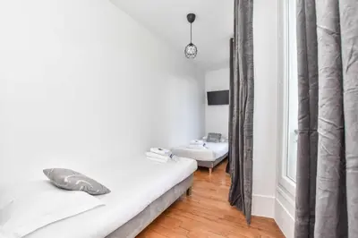 Un ou plusieurs lits dans un hébergement de l'établissement Charming apartment - 1BR 6P - Opéra Garnier