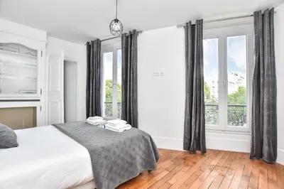 Un ou plusieurs lits dans un hébergement de l'établissement Charming apartment - 1BR 6P - Opéra Garnier