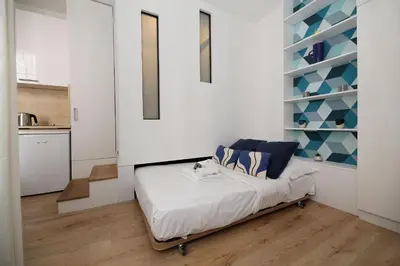 Un ou plusieurs lits dans un hébergement de l'établissement Studio original et reposant - Paris 10 - 2P