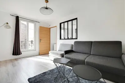 Coin salon dans l'établissement Authentic apartment - 1BR 5P - La Villette