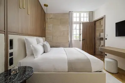Un ou plusieurs lits dans un hébergement de l'établissement Oniri - Serviced Apartment in Le Marais - Rue du Roi de Sicile