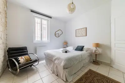Un ou plusieurs lits dans un hébergement de l'établissement Appartement familial proche des commerces - 8P