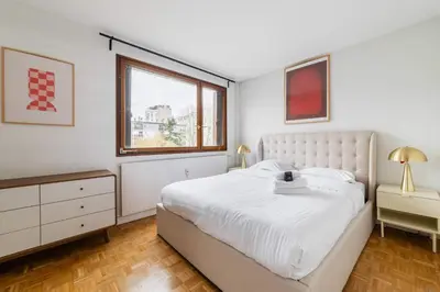 Un ou plusieurs lits dans un hébergement de l'établissement Appartement Paisible proche parc des princes - 4P